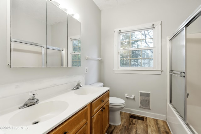 bathroom with a sink, visible vents, and a healthy amount of sunlight