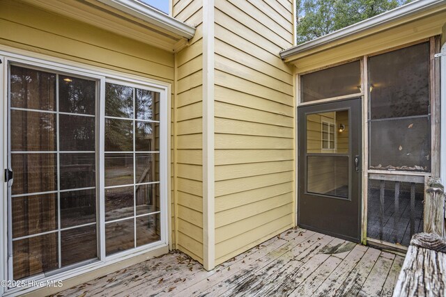 property entrance featuring a wooden deck