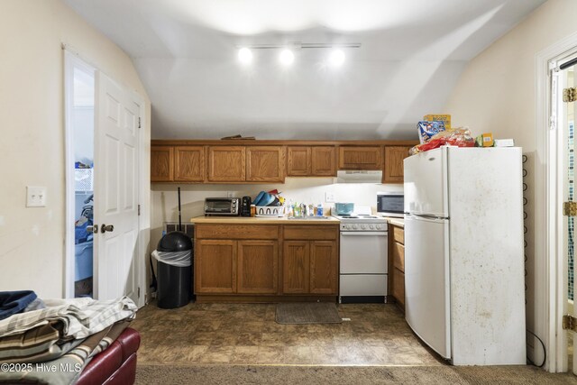 kitchen featuring brown cabinets, light countertops, a sink, white appliances, and extractor fan