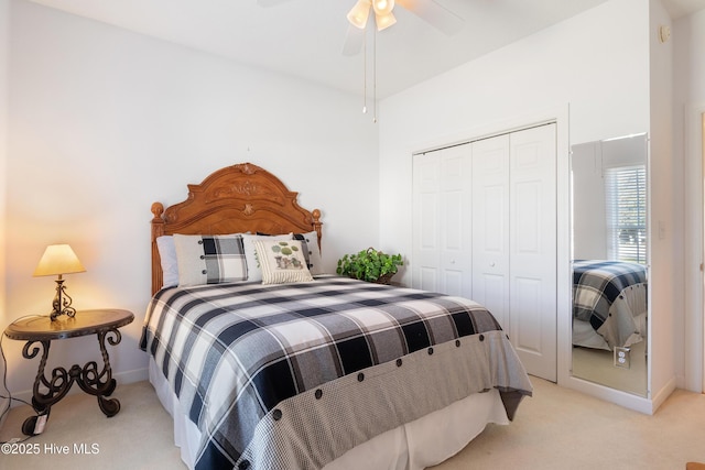 carpeted bedroom featuring a closet, a ceiling fan, and baseboards