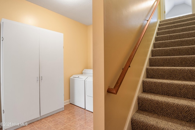 staircase featuring washer and dryer