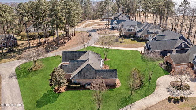 birds eye view of property with a residential view