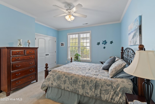 bedroom featuring a closet, visible vents, ornamental molding, light carpet, and ceiling fan