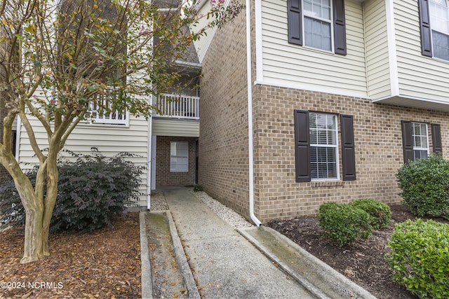 property entrance with brick siding