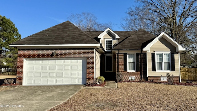 view of front facade featuring driveway, a garage, and brick siding