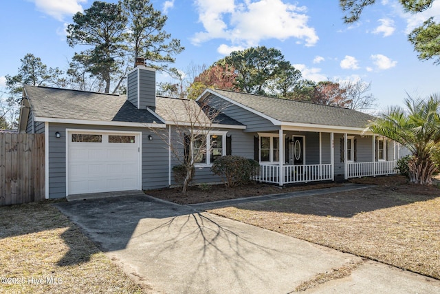 ranch-style home featuring driveway, roof with shingles, an attached garage, covered porch, and fence