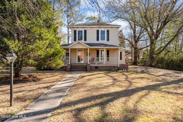 view of front facade with covered porch, crawl space, roof with shingles, and a chimney