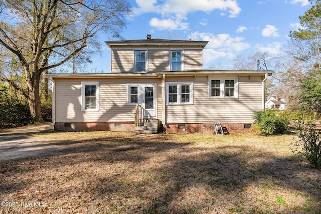 back of house with crawl space and entry steps