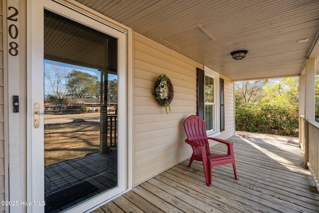 wooden deck featuring covered porch