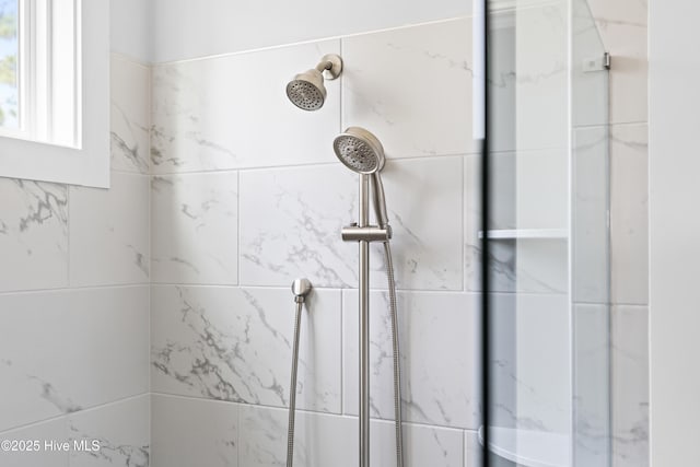 bathroom with tiled shower