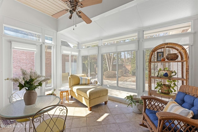 sunroom / solarium featuring a ceiling fan