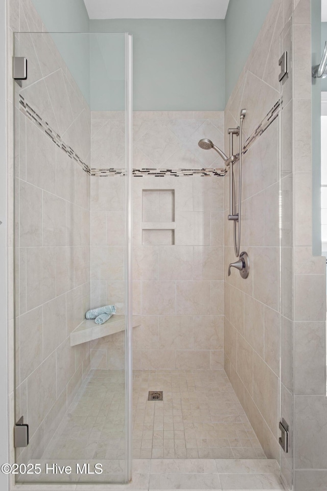 full bathroom with a shower stall