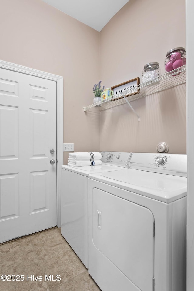 laundry area with laundry area and washer and clothes dryer