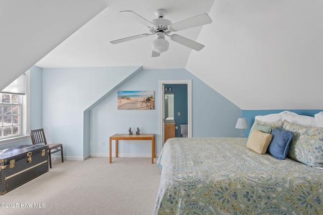 carpeted bedroom with vaulted ceiling, a ceiling fan, and baseboards