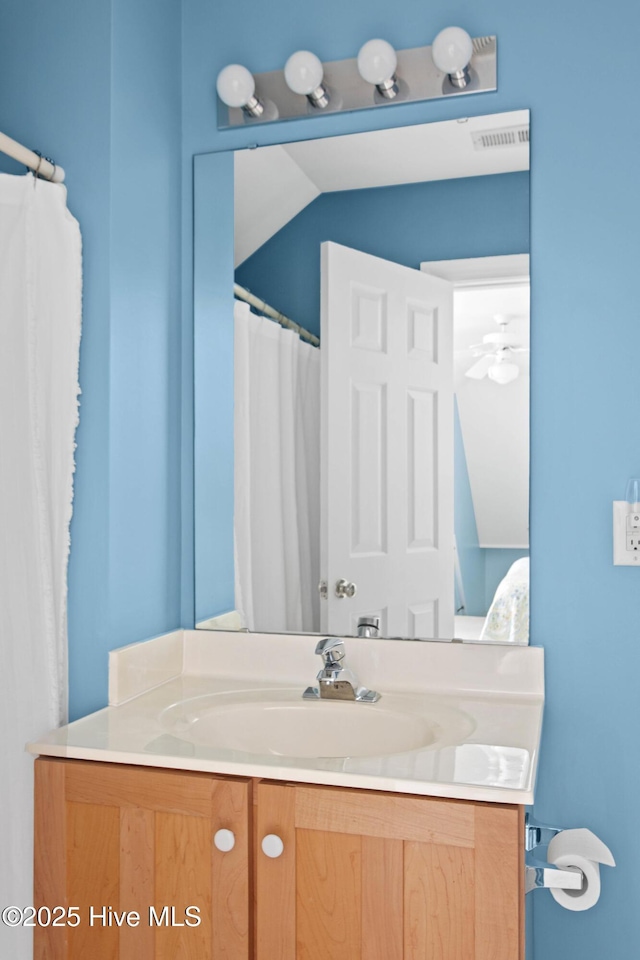 bathroom featuring visible vents and vanity