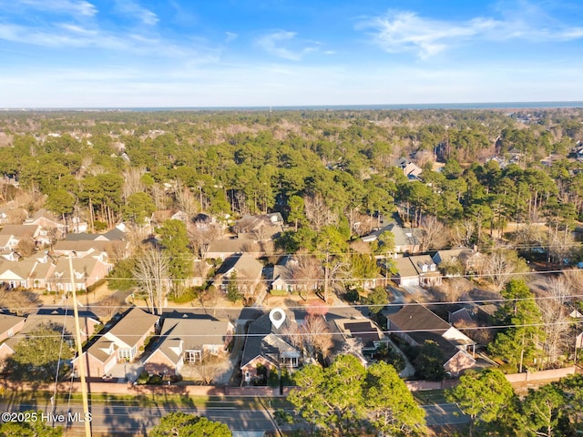 aerial view with a forest view and a residential view