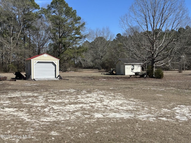 view of yard with a shed and an outdoor structure