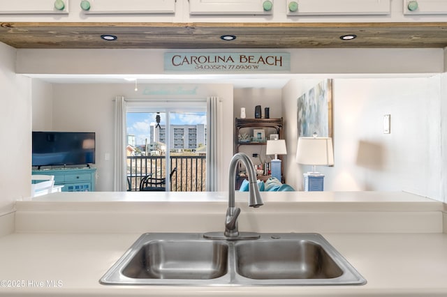 kitchen with light countertops and a sink