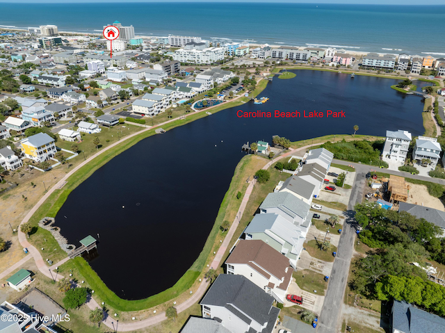 birds eye view of property featuring a water view