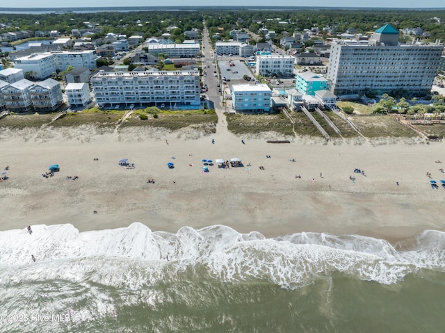 birds eye view of property with a view of city, a water view, and a view of the beach