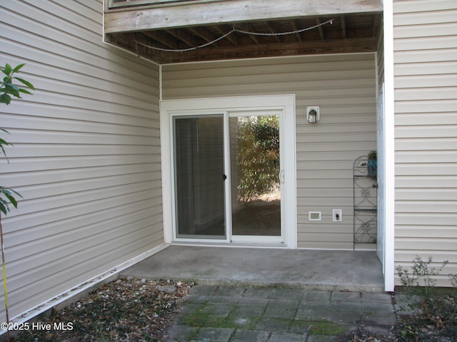 entrance to property with a patio