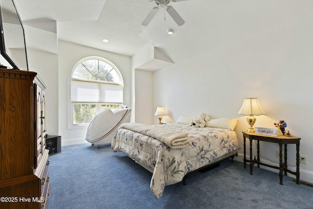 carpeted bedroom featuring ceiling fan, baseboards, and a textured ceiling