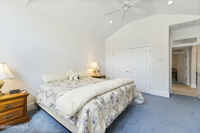 carpeted bedroom featuring lofted ceiling, ceiling fan, baseboards, and a closet