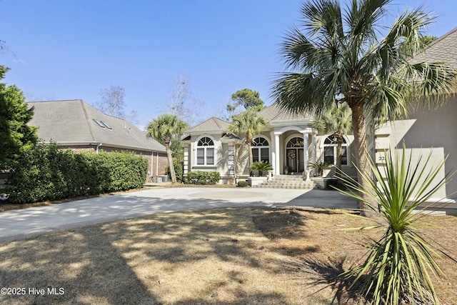 view of front of property featuring driveway and stucco siding