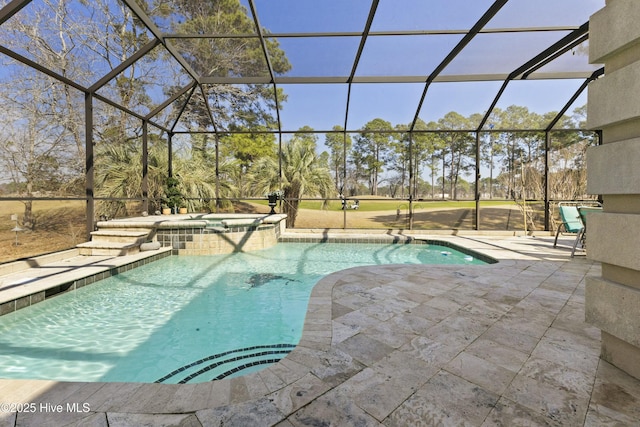 view of swimming pool with a lanai, a patio area, and a pool with connected hot tub