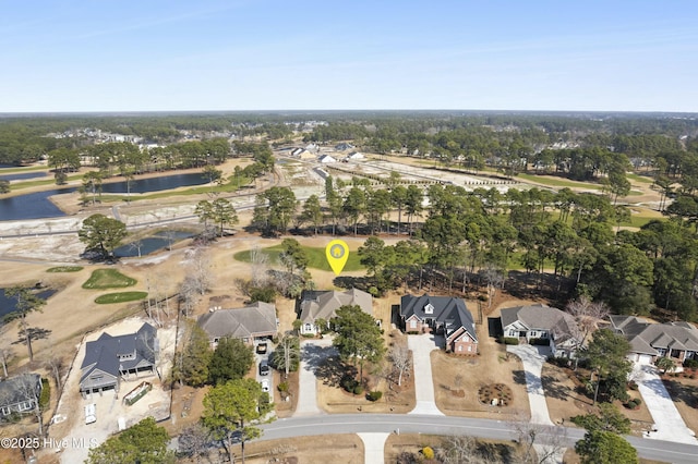 drone / aerial view with a residential view and a water view