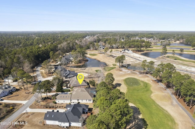 aerial view featuring a water view, golf course view, and a wooded view