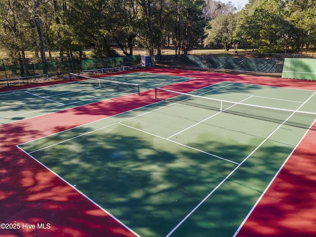 view of tennis court with fence