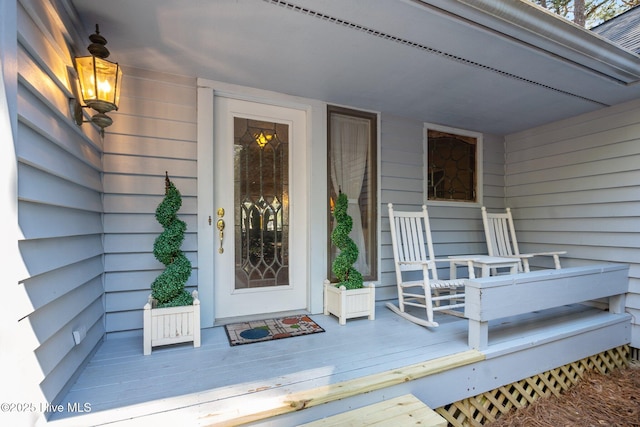 property entrance with covered porch