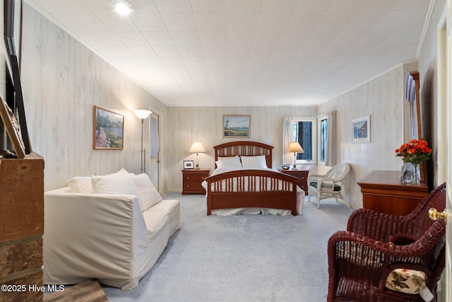 bedroom featuring carpet flooring and crown molding