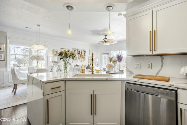 kitchen with visible vents, stainless steel dishwasher, a textured ceiling, wood finished floors, and a peninsula