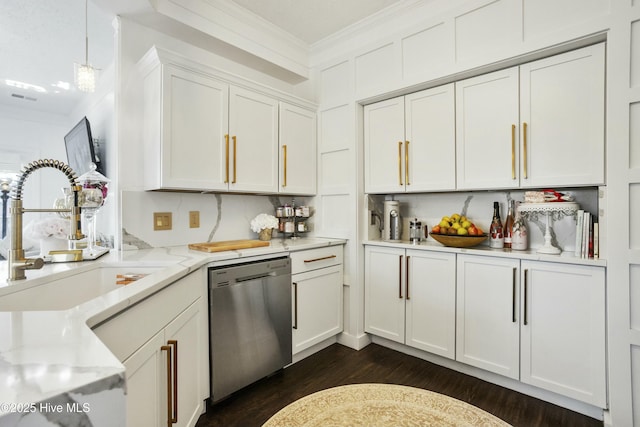 kitchen with crown molding, hanging light fixtures, white cabinetry, light stone countertops, and dishwasher