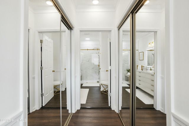 corridor with ornamental molding, dark wood-style flooring, and recessed lighting