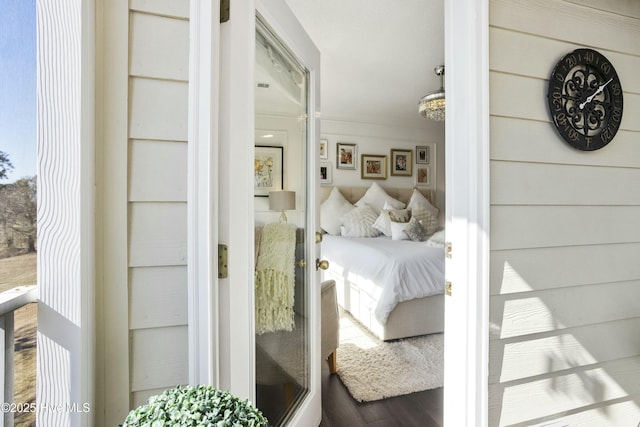 bedroom with wood finished floors