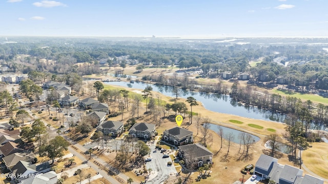 aerial view with golf course view and a water view