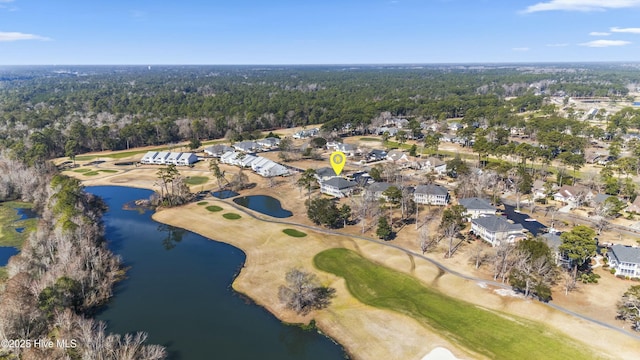 drone / aerial view with a water view and view of golf course