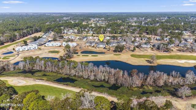 drone / aerial view featuring view of golf course and a water view