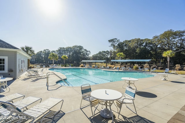 community pool with a patio area