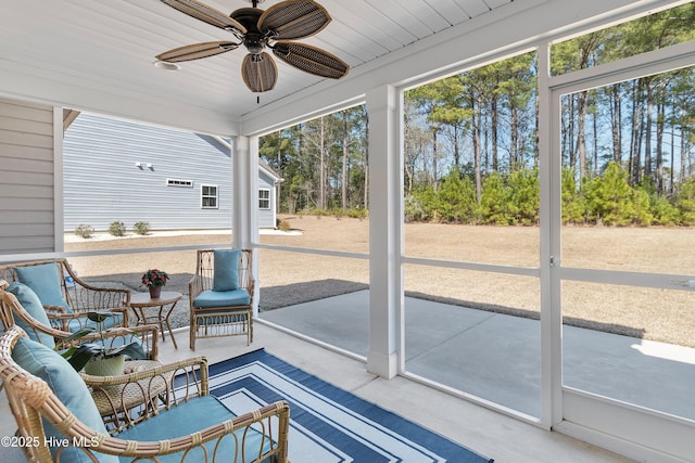 sunroom / solarium with ceiling fan