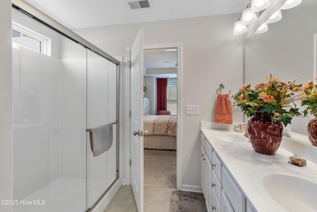 bathroom with plenty of natural light, ensuite bath, visible vents, and a sink