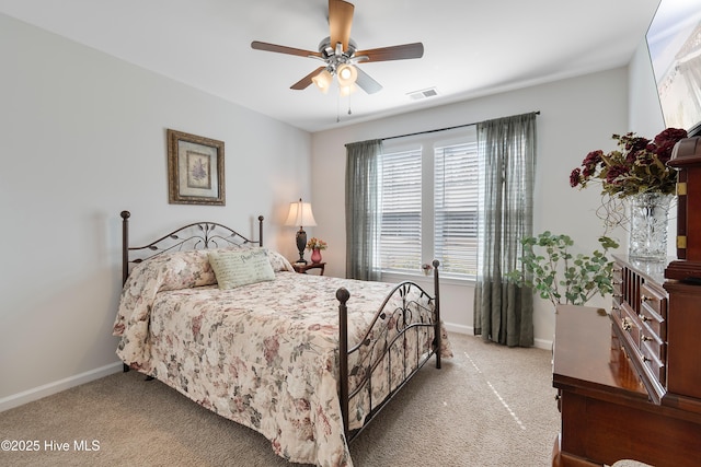 bedroom with baseboards, visible vents, and carpet flooring