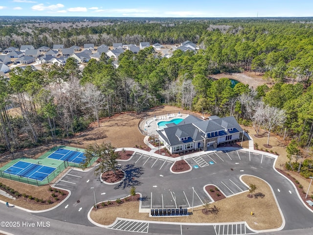 aerial view featuring a wooded view