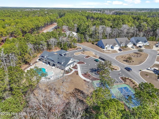 aerial view featuring a wooded view