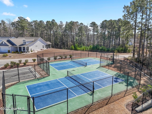 view of tennis court with fence