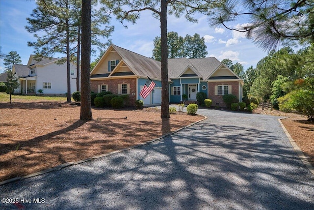 122 Smathers Dr, West End, NC 27376 - view of front of home featuring driveway and brick siding