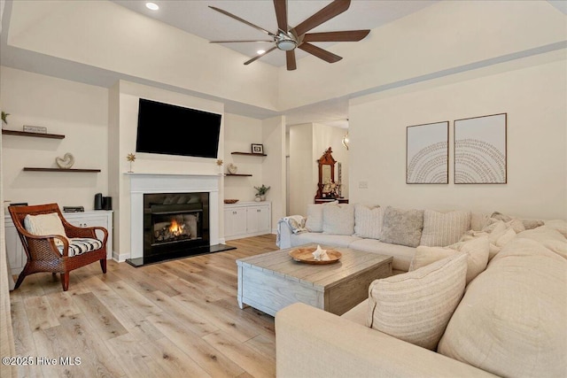 122 Smathers Dr, West End, NC 27376 - living room featuring ceiling fan, light wood-style flooring, a glass covered fireplace, and recessed lighting